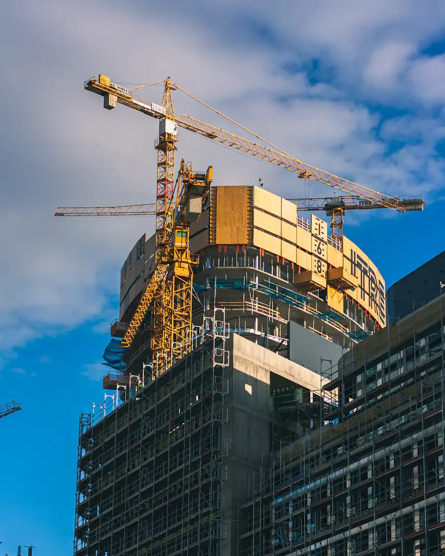 High-rise building under construction with tower cranes